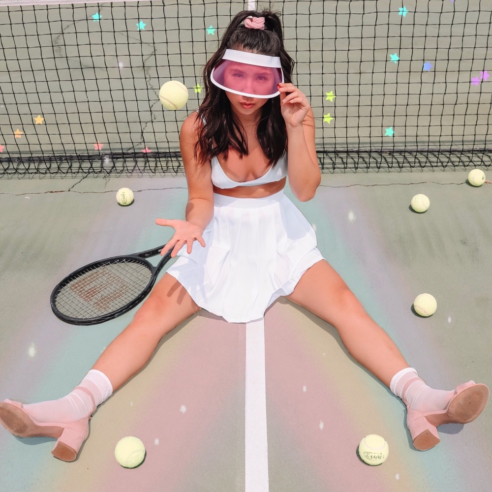 White pleated tennis or school girl mini skirt